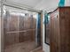 Elegant bathroom featuring a tiled glass shower and built in storage at 7268 Wichita Ct, Las Vegas, NV 89119