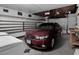 Spacious garage featuring ample storage shelves, washer and dryer plus parking for a vehicle at 7268 Wichita Ct, Las Vegas, NV 89119