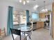 Eat in kitchen featuring stainless steel appliances, wood cabinets, and sliding glass doors to the backyard at 7268 Wichita Ct, Las Vegas, NV 89119
