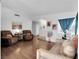 Comfortable living room featuring hardwood floors, ample seating, and bright, airy space at 7268 Wichita Ct, Las Vegas, NV 89119