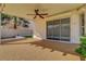 This covered patio features a ceiling fan, outdoor lighting, and access to the backyard at 7817 Safari Ln, Las Vegas, NV 89129