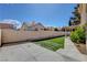 Large backyard with artificial turf and a concrete patio, perfect for outdoor entertaining at 7817 Safari Ln, Las Vegas, NV 89129