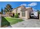 Home exterior with RV parking, artificial turf, and covered patio at 7817 Safari Ln, Las Vegas, NV 89129