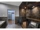Modern bathroom with a large glass walk-in shower and a separate room for closet at 7817 Safari Ln, Las Vegas, NV 89129