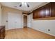 Spacious bedroom with a double-door closet, additional storage, and light hardwood floors at 7817 Safari Ln, Las Vegas, NV 89129