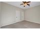 Bedroom features two white doors and a lighted ceiling fan above carpeted floors at 7817 Safari Ln, Las Vegas, NV 89129