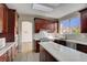 Updated kitchen features granite countertops, stainless steel appliances, and ample storage at 7817 Safari Ln, Las Vegas, NV 89129