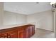 Loft with a built-in cabinet and carpeted floors at 7817 Safari Ln, Las Vegas, NV 89129