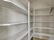 Walk-in pantry features multiple shelves for storage at 7817 Safari Ln, Las Vegas, NV 89129