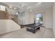 Large recreation room featuring high ceilings, a pool table, a staircase, and ample natural light from a large window at 7817 Safari Ln, Las Vegas, NV 89129