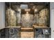 Luxurious walk-in shower featuring multiple shower heads, custom tile work, and integrated seating at 7817 Safari Ln, Las Vegas, NV 89129