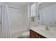 Bright bathroom features a shower-tub combo, toilet, and single sink vanity at 7872 Regency Park St, Las Vegas, NV 89149