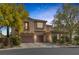 Charming two-story home featuring a three-car garage and beautifully landscaped front yard at 7872 Regency Park St, Las Vegas, NV 89149