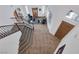 Bright and open foyer features a staircase, tile flooring, and comfortable seating area at 7872 Regency Park St, Las Vegas, NV 89149