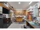 Organized garage with shelving, tool storage, workbench, and television at 7872 Regency Park St, Las Vegas, NV 89149