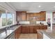 Well-equipped kitchen features granite countertops, stainless steel appliances, and ample cabinet space at 7872 Regency Park St, Las Vegas, NV 89149