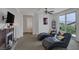 Comfortable living area featuring plush seating, fireplace, and access to outdoor views at 7872 Regency Park St, Las Vegas, NV 89149