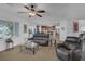 Comfortable living room features a ceiling fan and view to the kitchen area at 7872 Regency Park St, Las Vegas, NV 89149
