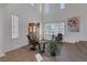 Bright living room features large windows, comfortable seating, and a charming display cabinet at 7872 Regency Park St, Las Vegas, NV 89149