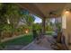 Spacious covered patio with lush greenery and comfortable seating at 7872 Regency Park St, Las Vegas, NV 89149