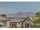 Scenic view showcases mountain landscapes and residential rooftops in a sunny, clear setting at 7872 Regency Park St, Las Vegas, NV 89149