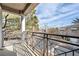 View from balcony with iron railing, showing blue sky and neighborhood trees at 805 Dana Hills Ct # 104, Las Vegas, NV 89134