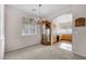 Open concept dining area with view of the kitchen, plus neutral carpet at 805 Dana Hills Ct # 104, Las Vegas, NV 89134