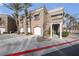 Charming two-story condo with manicured landscaping, garages and palm trees at 805 Dana Hills Ct # 104, Las Vegas, NV 89134