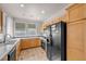 Well-lit kitchen featuring tile flooring, stainless steel appliances and light wood cabinets at 805 Dana Hills Ct # 104, Las Vegas, NV 89134