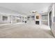 Bright living room featuring a fireplace, ceiling fan, balcony access, and a mirrored wall at 805 Dana Hills Ct # 104, Las Vegas, NV 89134