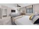 Bright main bedroom with modern decor, ceiling fan, and carpet flooring providing a comfortable space at 805 Dana Hills Ct # 104, Las Vegas, NV 89134