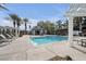 Resort-style community pool with lounge chairs, cabanas, and lush landscaping for relaxation and enjoyment at 805 Dana Hills Ct # 104, Las Vegas, NV 89134