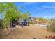 Large backyard with a hot tub, fire pit, and mature landscaping, creating a private retreat for relaxation and enjoyment at 8058 Big Skye Ranch St, Las Vegas, NV 89166