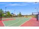 Outdoor basketball court featuring two hoops, colorful court markings, and well-maintained landscaping at 8058 Big Skye Ranch St, Las Vegas, NV 89166