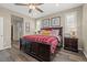 Cozy bedroom featuring hardwood floors, neutral walls, and natural light from shuttered windows at 8058 Big Skye Ranch St, Las Vegas, NV 89166