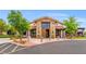 Clubhouse exterior featuring stone accents, tiled roof, and well-maintained landscaping for a welcoming ambiance at 8058 Big Skye Ranch St, Las Vegas, NV 89166
