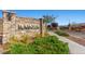 Stone entrance sign with 'RAINIER' lettering, showcasing the community's welcoming and established feel at 8058 Big Skye Ranch St, Las Vegas, NV 89166