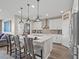 Spacious kitchen featuring a large island, pendant lighting, modern appliances and ample counter space at 8058 Big Skye Ranch St, Las Vegas, NV 89166