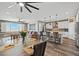 Open-concept living space with hardwood floors, modern kitchen, and dining area at 8058 Big Skye Ranch St, Las Vegas, NV 89166