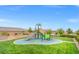 Community playground featuring a slide, climbing structure, and safety surface for fun and recreation at 8058 Big Skye Ranch St, Las Vegas, NV 89166