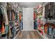 Spacious walk-in closet features custom shelving and storage cabinets for optimal organization and ample space at 8058 Big Skye Ranch St, Las Vegas, NV 89166