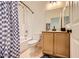 A well-lit bathroom featuring a shower/tub combo, a white toilet, and a stylish vanity at 8091 Mosaic Sunrise Ln, Las Vegas, NV 89166