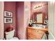 Charming powder room featuring a decorative vanity, unique accents, and a vintage-inspired mirror at 8091 Mosaic Sunrise Ln, Las Vegas, NV 89166