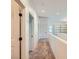 Bright hallway featuring neutral walls, carpet and access to multiple rooms, creating seamless transition in the home at 8091 Mosaic Sunrise Ln, Las Vegas, NV 89166