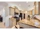 Modern kitchen featuring granite countertops, stainless steel appliances, and an efficient layout at 8091 Mosaic Sunrise Ln, Las Vegas, NV 89166
