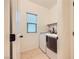 Convenient laundry room equipped with a modern washer and dryer, and natural light at 8091 Mosaic Sunrise Ln, Las Vegas, NV 89166