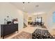 Inviting living space featuring modern decor, tiled floors, and an open layout to dining area at 8091 Mosaic Sunrise Ln, Las Vegas, NV 89166