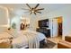 Bright bedroom with a ceiling fan, walk-in closet and television at 8091 Mosaic Sunrise Ln, Las Vegas, NV 89166