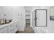 Modern bathroom with double vanity, walk-in shower, soaking tub and a spacious walk-in closet at 84 Via Franello, Henderson, NV 89011