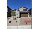 Charming two-story home featuring a two-car garage, stone accents, and low-maintenance landscaping at 84 Via Franello, Henderson, NV 89011